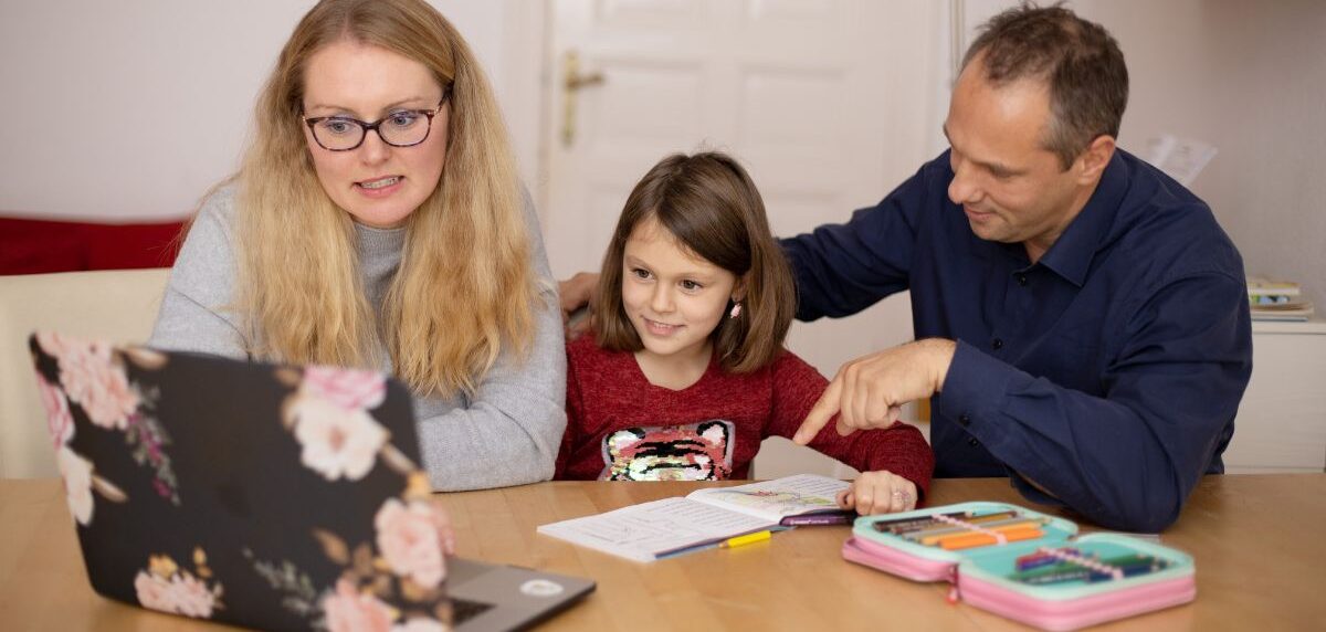 Parent reviewing their child’s academic progress report and tutoring results online.
