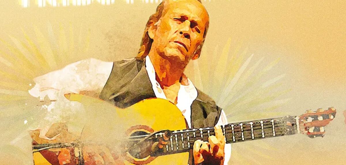 Paco de Lucía passionately playing flamenco guitar on stage